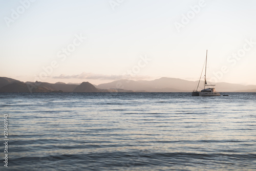 A sail boat on the Aegean Sea during sunrise in Kos, Greece. 