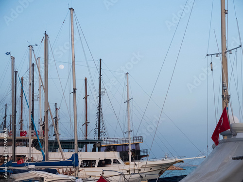 Full moon between masts of nautical vessels with Turkish and St.Andrew flag