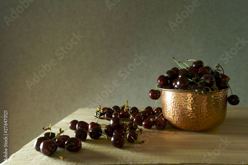 Chein copper pot on wooden surface photo