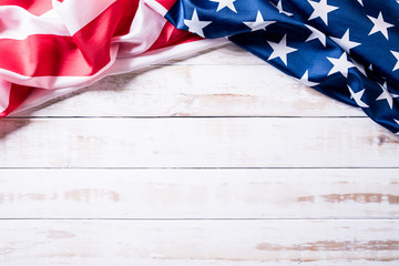 Top view of Flag of the United States of America on white wooden background. Independence Day USA, Memorial.