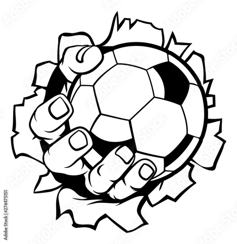 A strong hand holding a soccer football ball tearing through the background. Sports graphic