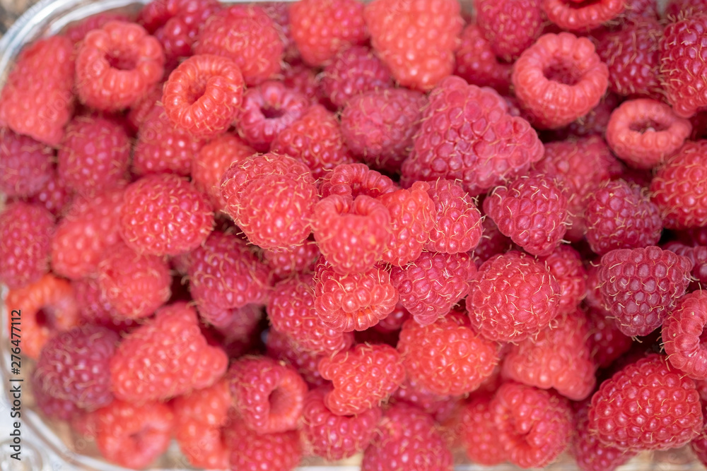 Fresh picked up red raspberries in box Fresh picked up red raspberries in box