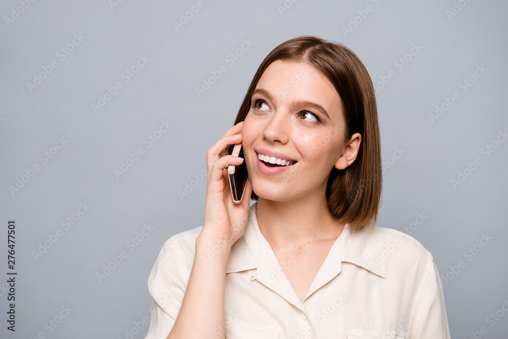 Close up photo amazing beautiful she her lady hold hands arms telephone wondered interested curious listen mom mommy parents dad daddy glad be in touch wear casual white shirt isolated grey background Close up photo amazing beautiful she her lady hold hands arms telephone wondered interested curious listen mom mommy parents dad daddy glad be in touch wear casual white shirt isolated grey background