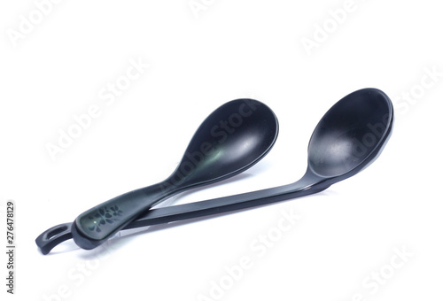 plastic black spoon, isolated on white background
