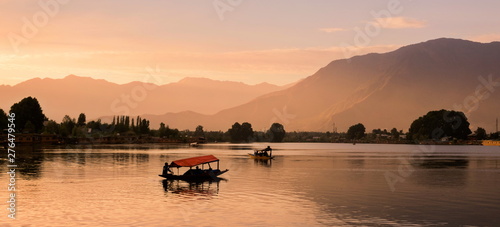 Shikara boats on Dal Lake with Sunset Dal Lake in Srinagar Jammu and Kashmir state India photo