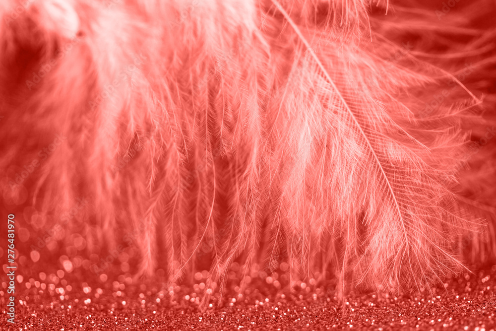 Fototapeta premium Gentle magical golden background with yellow feather. Macro photo.