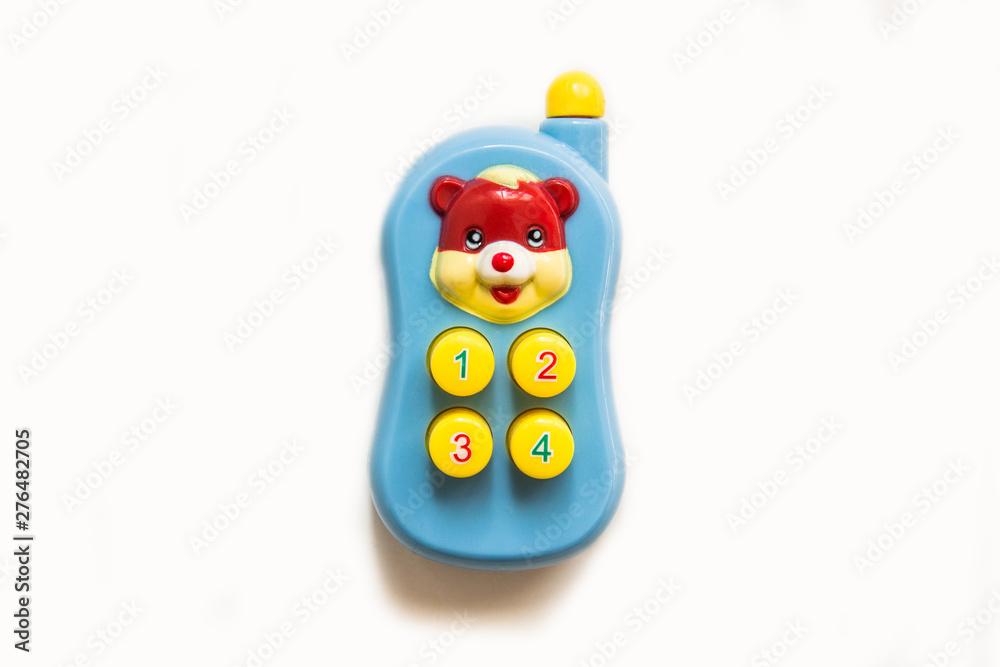 Colorful plastic toy mobile phone. Toy Mobile Phone on White Background.