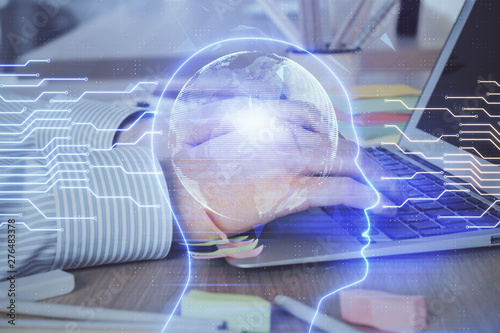 Man typing on keyboard background with brain hologram. Concept of big Data. Double exposure.