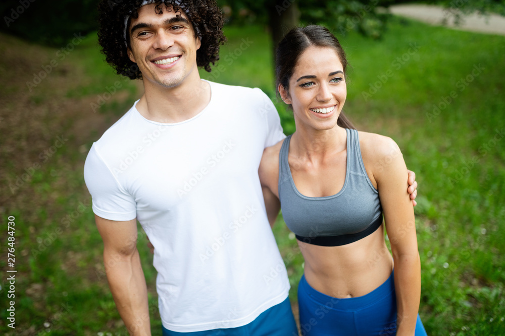 Fototapeta premium Happy couple running and jogging together outdoor