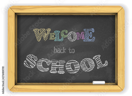 Blackboard with chalk on a brick wall welcomes children to school on a flyer or banner. Bright lively color chalk letters on woodern board for a welcome party poster photo