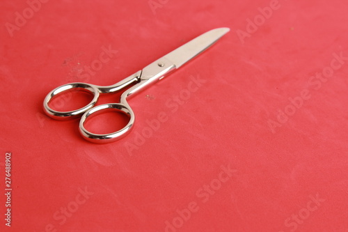 sewing scissors on colorful background