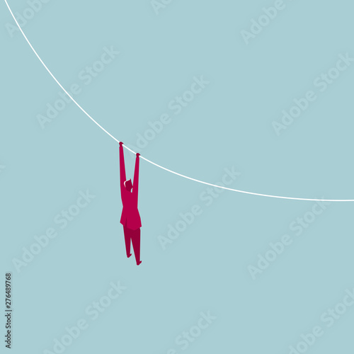 Businessman hangs in mid air. Isolated on blue background.