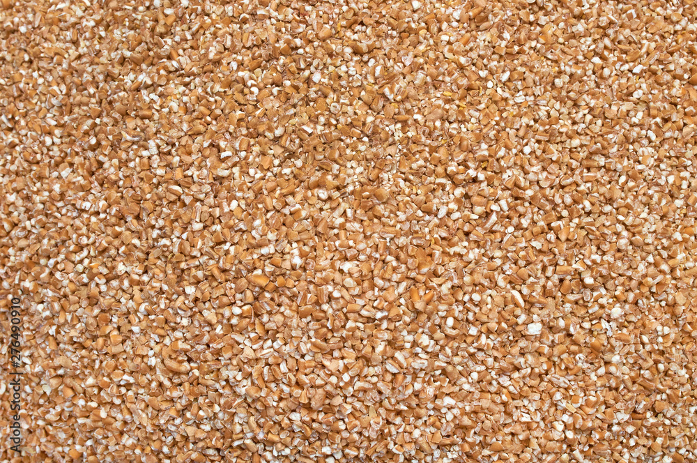Background texture of crushed seed and grain mix for livestock and bird feed Background texture of crushed seed and grain mix for livestock and bird feed