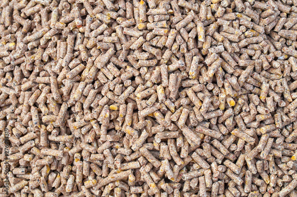 Background texture of crushed seed and grain mix for livestock and bird feed Background texture of crushed seed and grain mix for livestock and bird feed