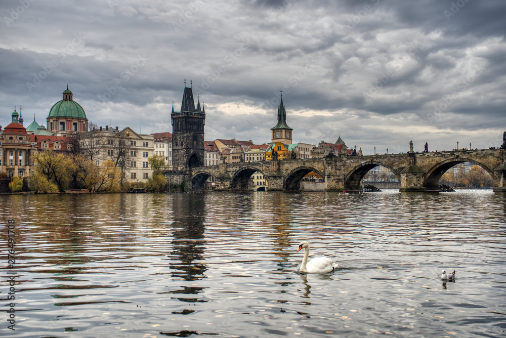 The Charles Bridge over the Vltava River in Prague, Czech Republic. This picture was taken in autumn. 