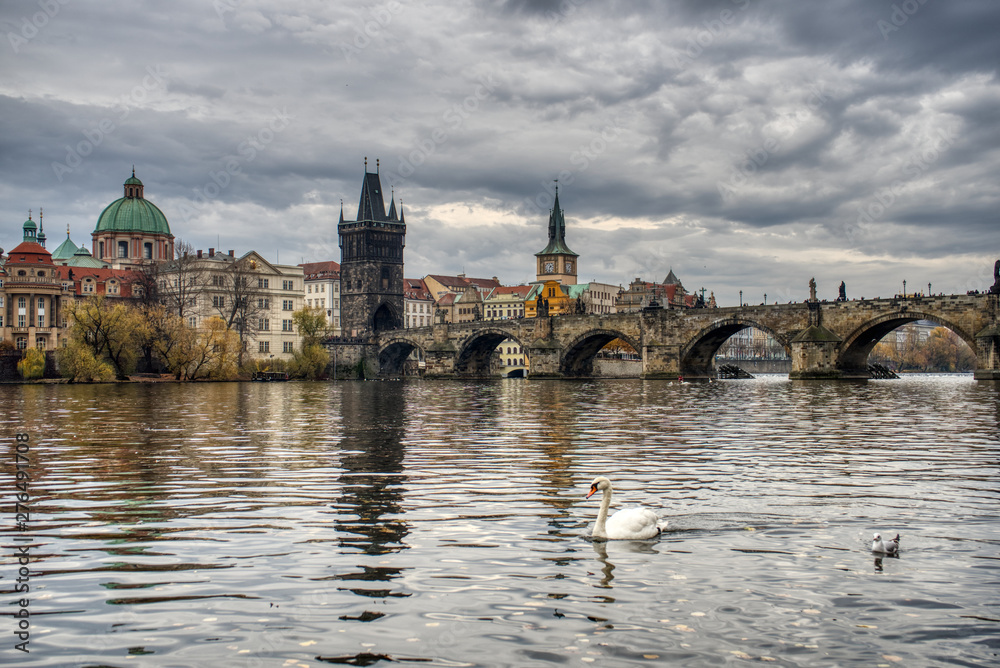 The Charles Bridge over the Vltava River in Prague, Czech Republic. This picture was taken in autumn. The Charles Bridge over the Vltava River in Prague, Czech Republic. This picture was taken in autumn.
