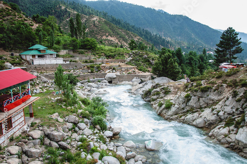 Restaurants on the bank of the river in mountains 