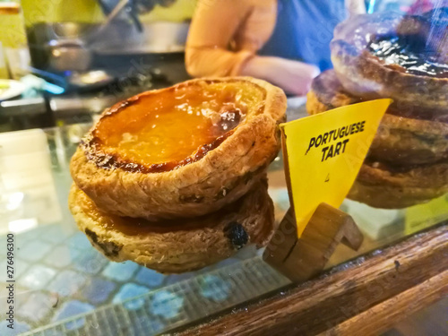 Photography Sweet crispy stack of Portuguese egg tart