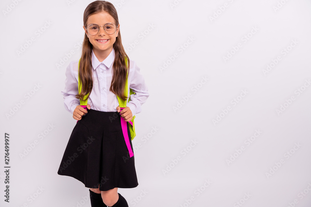 Portrait of her she nice attractive lovely winsome smart clever intelligent cheerful cheery positive pre-teen girl isolated over light white grey background Portrait of her she nice attractive lovely winsome smart clever intelligent cheerful cheery positive pre-teen girl isolated over light white grey background
