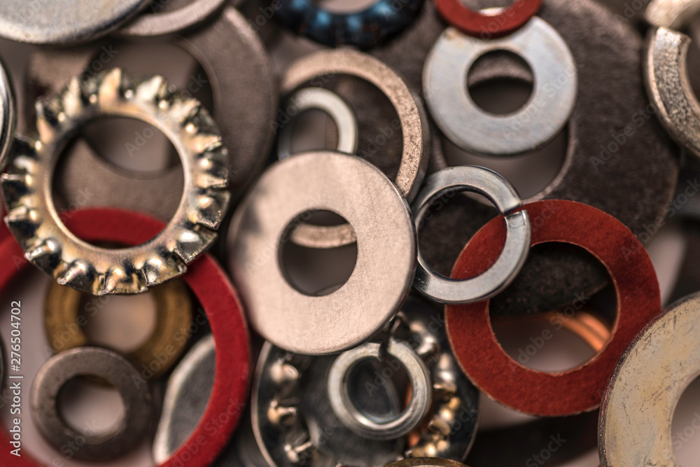 Divers industrial washers and rings. Various colorful washers rings on white background Screw washer. Divers industrial washers and rings. Various colorful washers rings on white background Screw washer.
