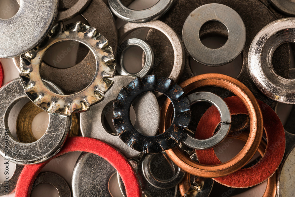 Divers industrial washers and rings. Various colorful washers rings on white background Screw washer. Divers industrial washers and rings. Various colorful washers rings on white background Screw washer.