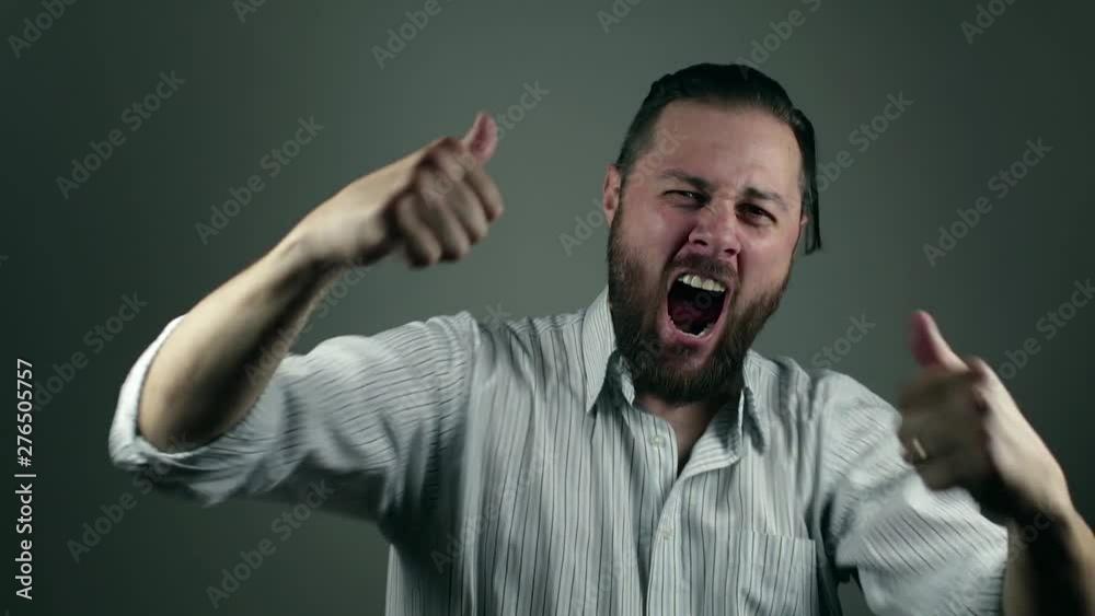 Business man yelling in joy of a business success. Beard man over reacting on his success