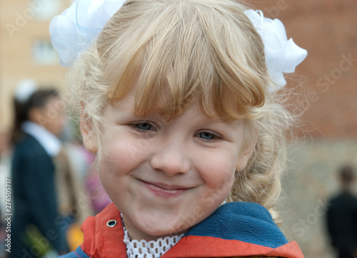 portrait of a little blond girl smiling