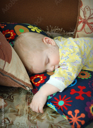 baby child sleeping on a blanket