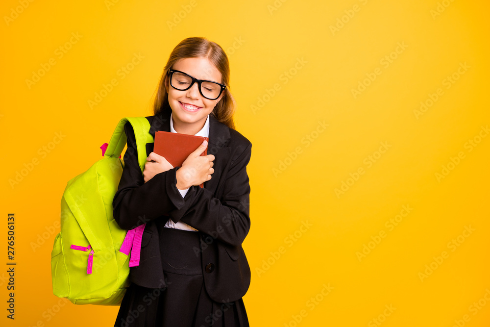 Portrait of cheerful cute kid hold hand fantasy book close eyes have eyewear eyeglasses isolated over yellow background Portrait of cheerful cute kid hold hand fantasy book close eyes have eyewear eyeglasses isolated over yellow background