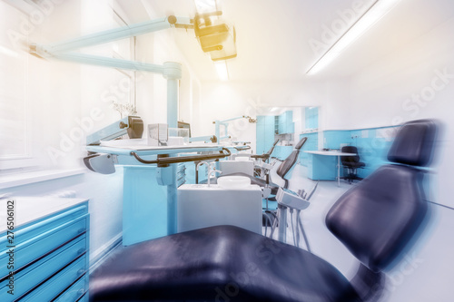 dental clinic interior with dentist chair and modern blue dentistry equipment  -
