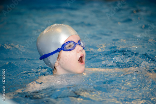 portrait of a child in swimming pool