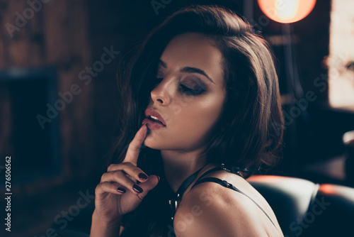 Close-up portrait of lovely exquisite attractive magnificent stunning charming wavy-haired lady in swordbelt enjoying lifestyle touching lip closed eyes at loft industrial interior wood photo