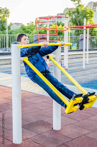 Teenager trains on the training apparatus