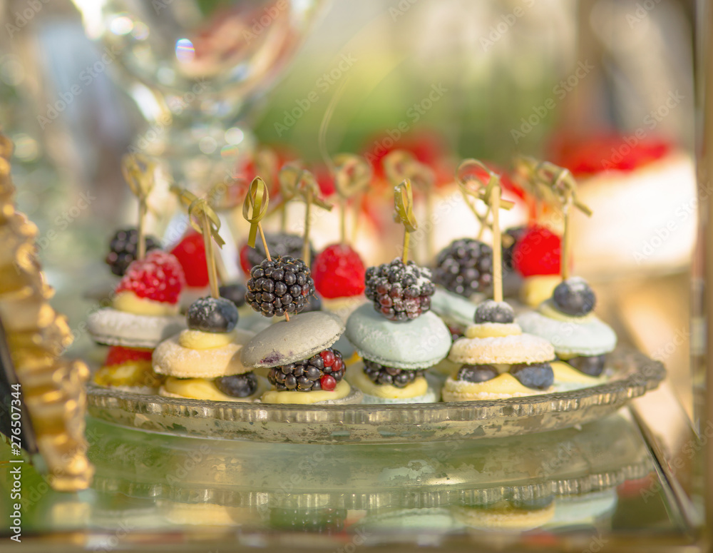 Background from traditional French Macaroon Desserts with berries and Fruits with Cream for Birthday and Wedding