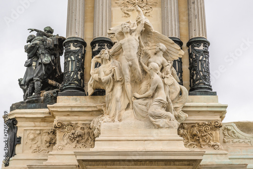 Pedestal details of statue of king Alfonso XII of Spain in Buen Retiro park, commonly known as El Retiro in Madrid, capital city of Spain photo