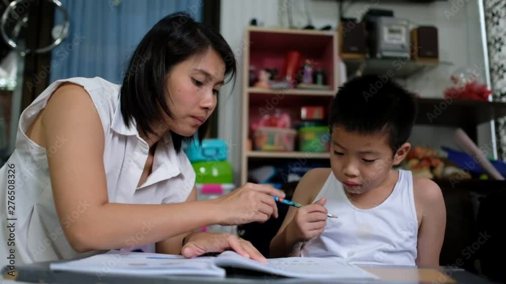 children boy doing homework with mother, kid write paper, family concept, learning time, student, back to school children boy doing homework with mother, kid write paper, family concept, learning time, student, back to school