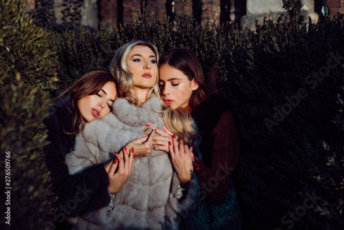Attraction and magnetism. Warm clothes. Fashion outfit. Fashion women fur coats. Dreamy and mysterious. Sensual girls fur clothes cuddling nature background. Girls fashion models wear furry clothes