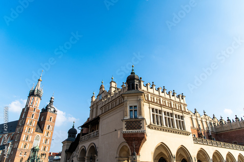 Krakow, Poland - April, 2019: Old city center view with Adam Mickiewicz monument and St. Mary's Basilica in Krakow photo