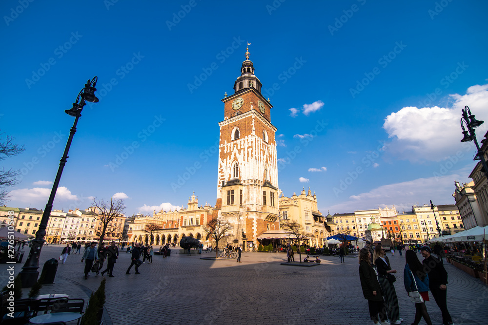 Poland, Krakow - April, 2019: Main Market Square and St Mary Church.