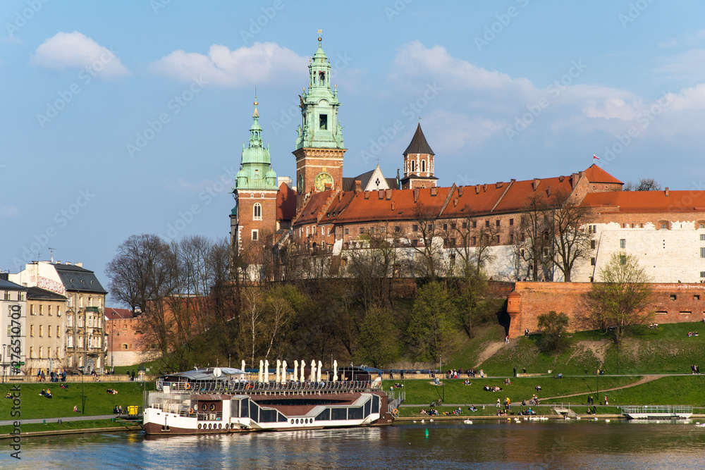 Krakow, Poland - April, 2019: Wawel castle famous landmark in Krakow Poland. Picturesque landscape on coast river Wisla.