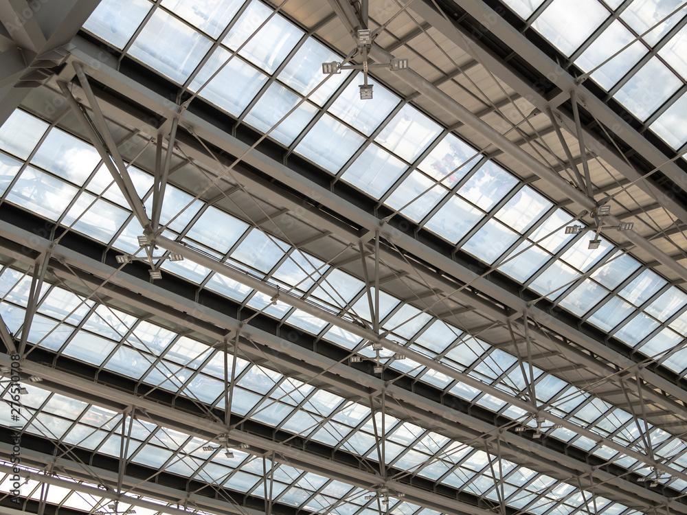 Abstract high-tech architecture background photo, Large steel structure truss, roof frame and metal sheet in building construction site in the airport.