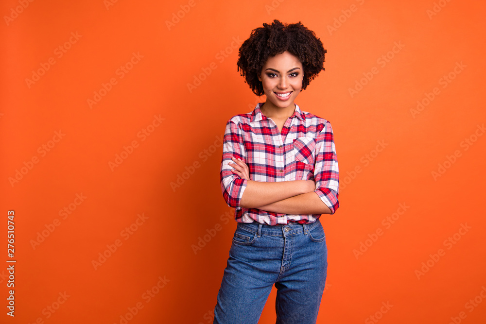 Portrait of her she nice-looking attractive winsome lovely cheerful cheery wavy-haired lady wearing checked shirt folded arms good day isolated on bright vivid shine orange background - obrazy, fototapety, plakaty 