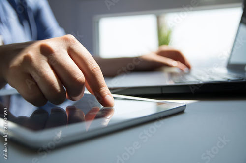 Close up of woman hand's using tablet touchscreen