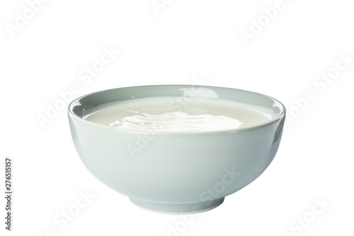 Bowl of sour cream yogurt isolated on white background