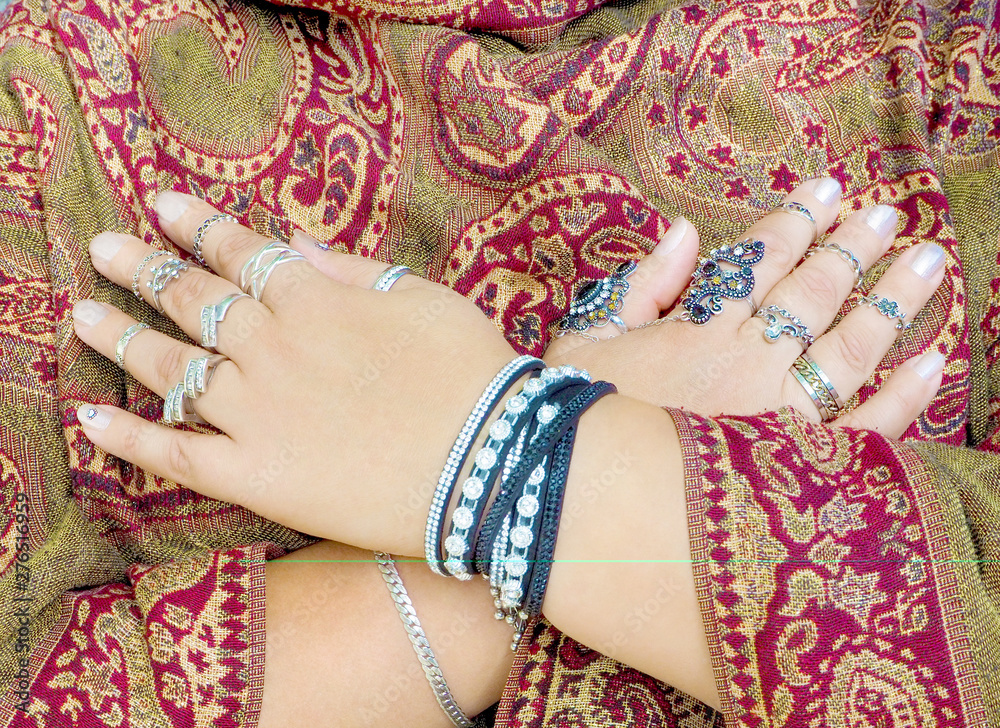 Close-up of a woman's hands with many beautiful rings