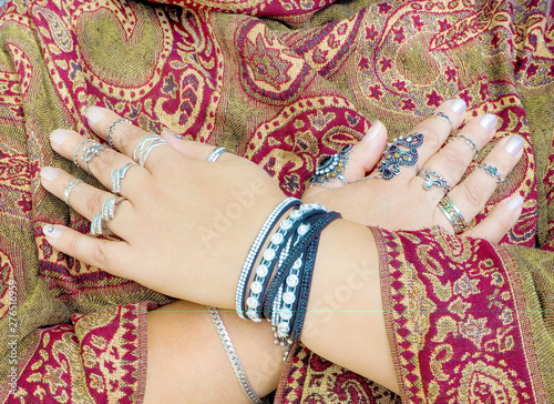 Close-up of a woman's hands with many beautiful rings