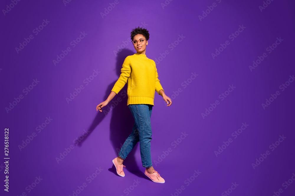 Full length body size view portrait of nice attractive charming lovely peaceful content wavy-haired lady walking isolated over bright vivid shine violet background