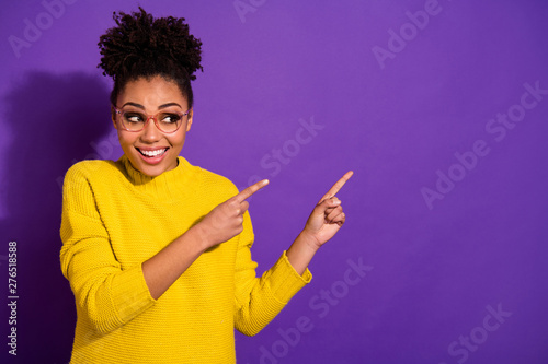 Portrait of her she nice attractive cheerful cheery glad wavy-haired girl showing copy space ad advert tips feedback isolated over bright vivid shine violet background