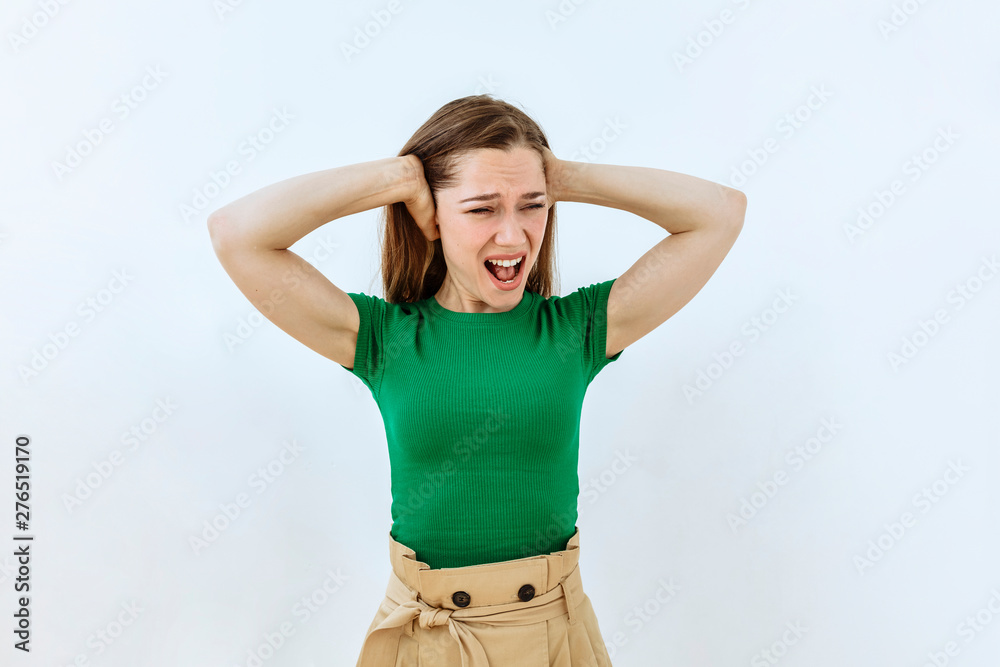 Frustrated and stress emotion. Portrait of Cheerful girl against white background Frustrated and stress emotion. Portrait of Cheerful girl against white background