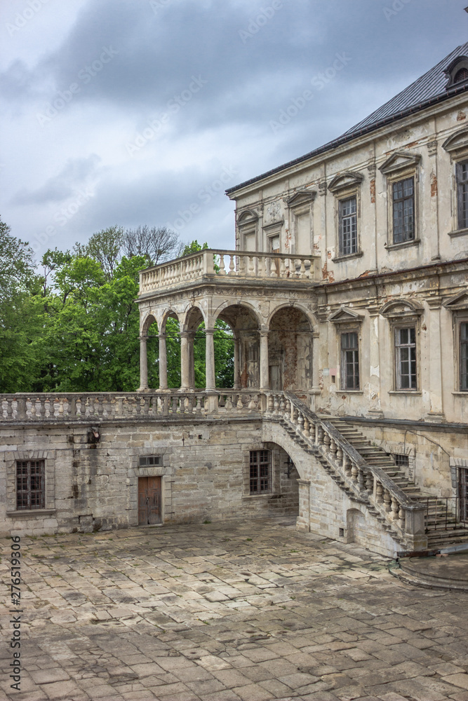 The medieval architecture of Europe. Old stone castle. Pidhirtsi Castle. Reconstruction of a historic building. Pillars and stairs. Castles of Western Ukraine. Location for the film.